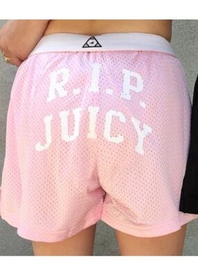 UNIF size M Pink UNIF gym shorts with "R.I.P. Juicy" on the back